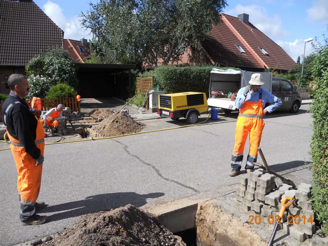 Operatives at a launch pit on a residential street