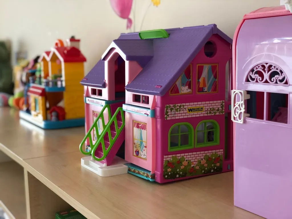 Colourful dolls’ houses on a shelf