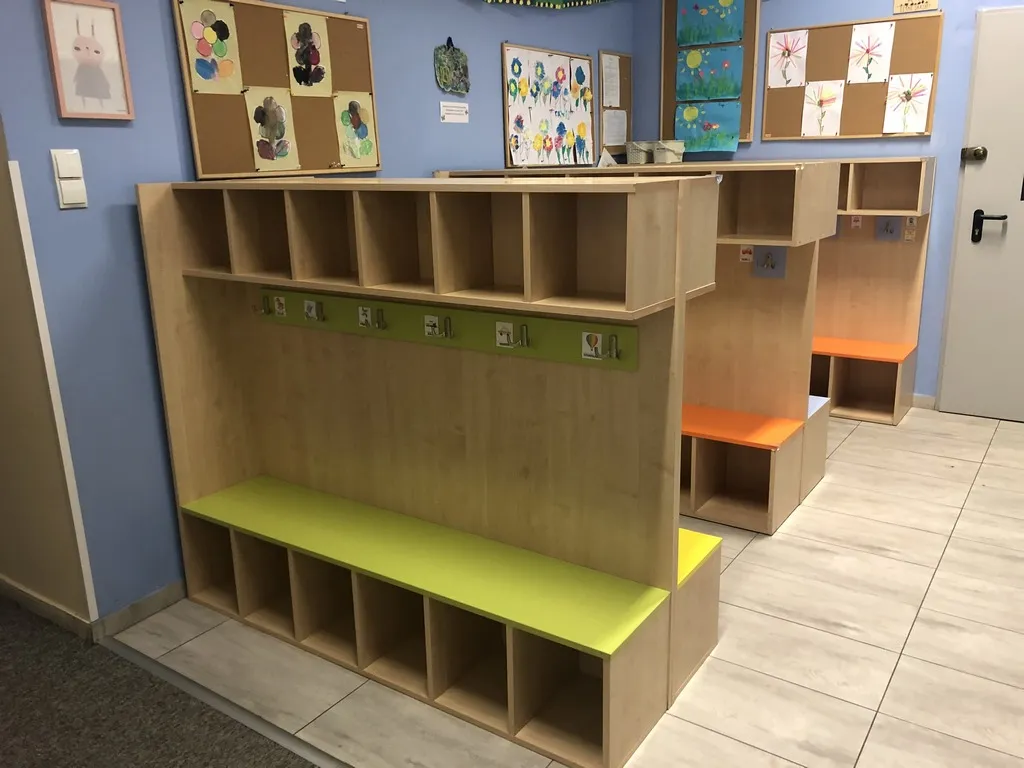 Cloakroom with wooden cubbies for clothes